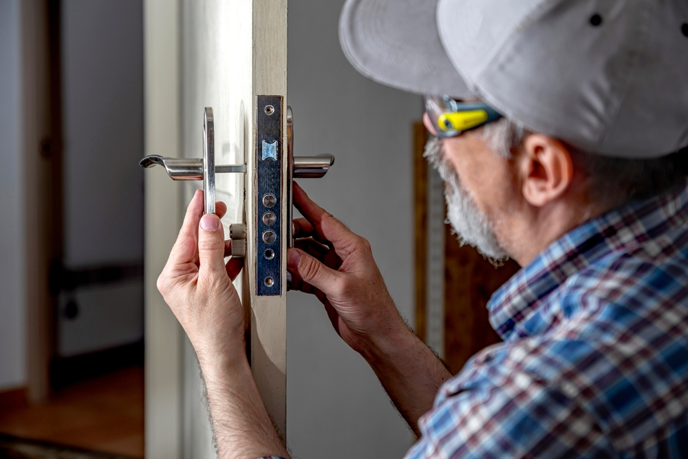 Urgent locksmith service responding to a late-night call, with a lighted van in a residential area