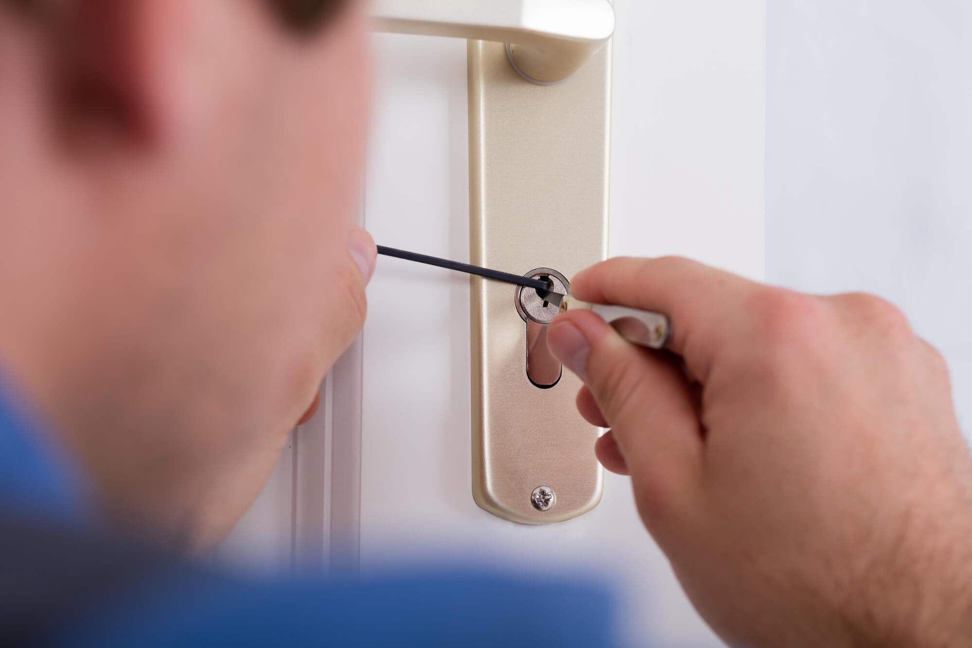 Local locksmith interacting with a satisfied customer in a neighbourhood setting